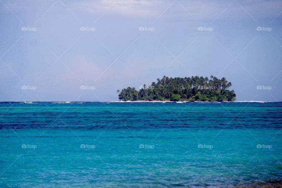 Deserted island in Polynesia. Postcard like island at pacific ocean 