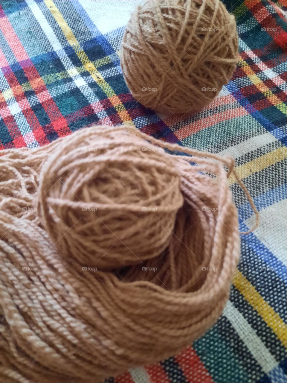 rolling a ball of wool
