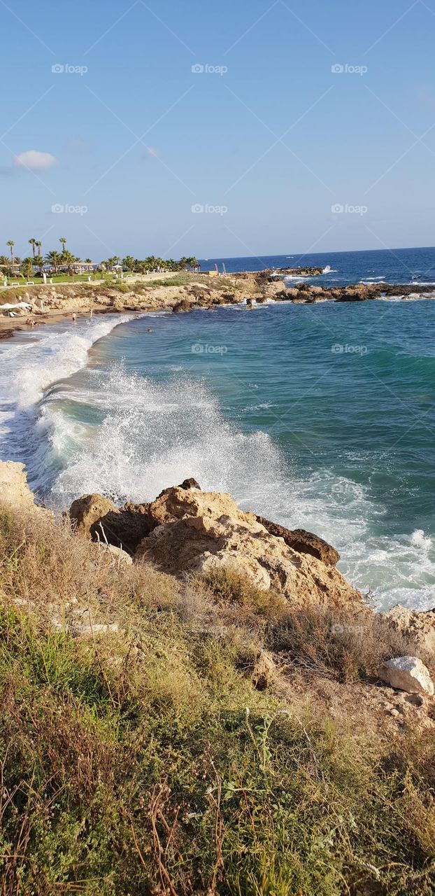 Massive waves hiting the rocks