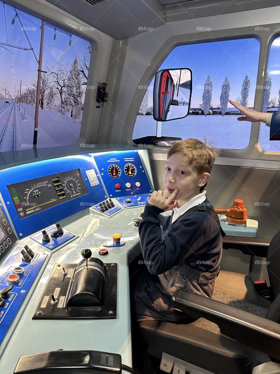 Red hair boy playing in train 