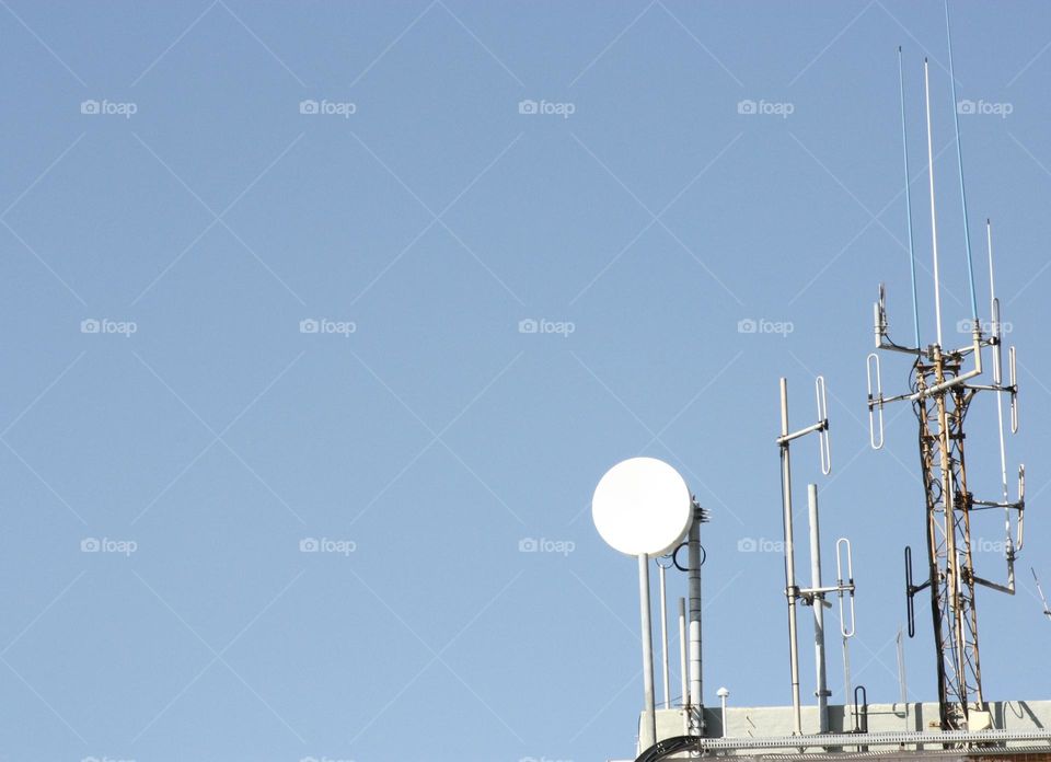 a satellite dish on a roof.