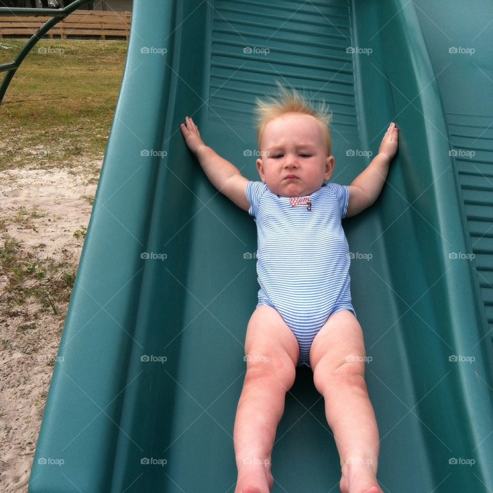 Too funny! He only slides down so he can climb back up