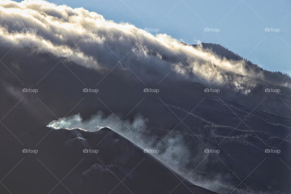 View of the smoking Tajogaite volcano on La Palme
