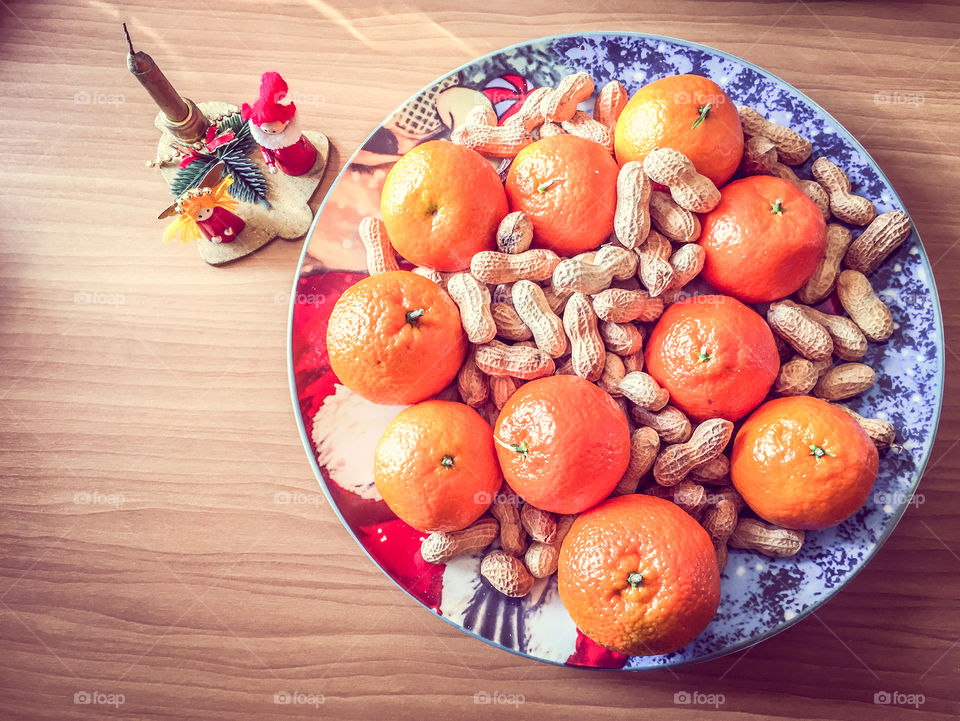 Christmas Candle And Food Decoration With Mandarins And Peanuts Festive Plate
