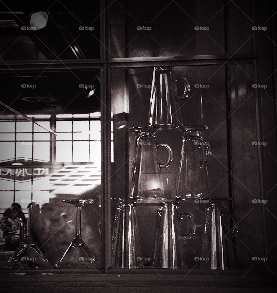 Stacked . Glasses stacked behind the bar, ready to go