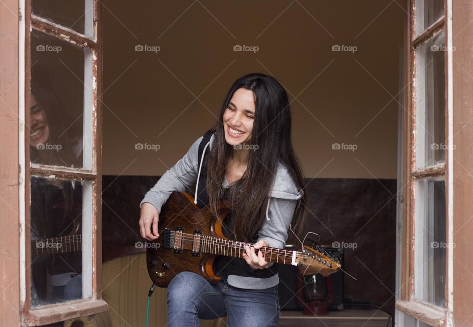 Happy moments with her guitar