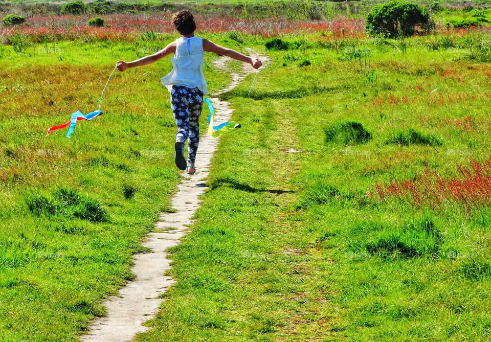 Girl Running Down A Country Lane