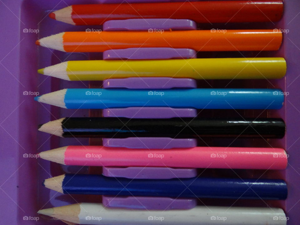 Colorful Creations. Row of colored pencils in an art kit. 