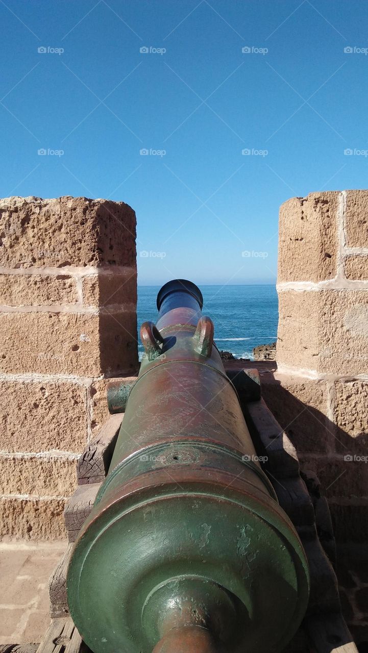 An old Portuguese gun watching the sea