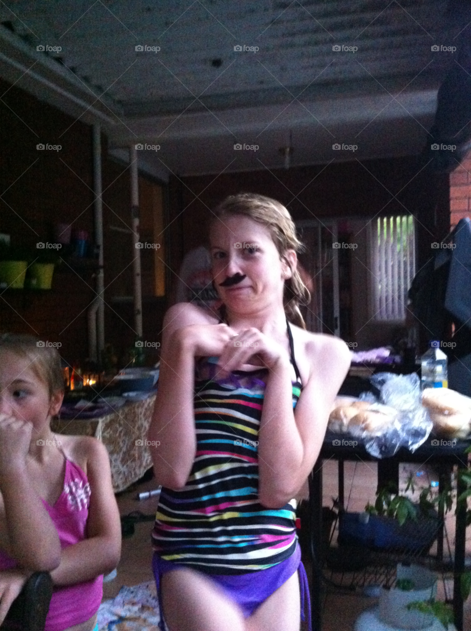 Moustache child. Child being silly