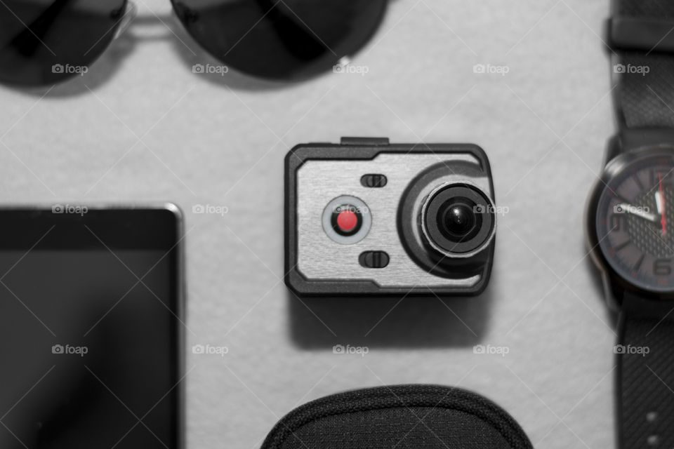 Very small action camera as part of male accessories 