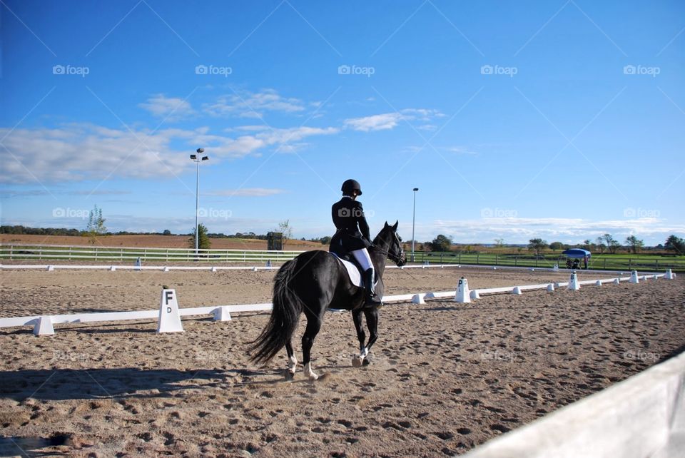 Heading home . A horse and rider heading back after eventing 