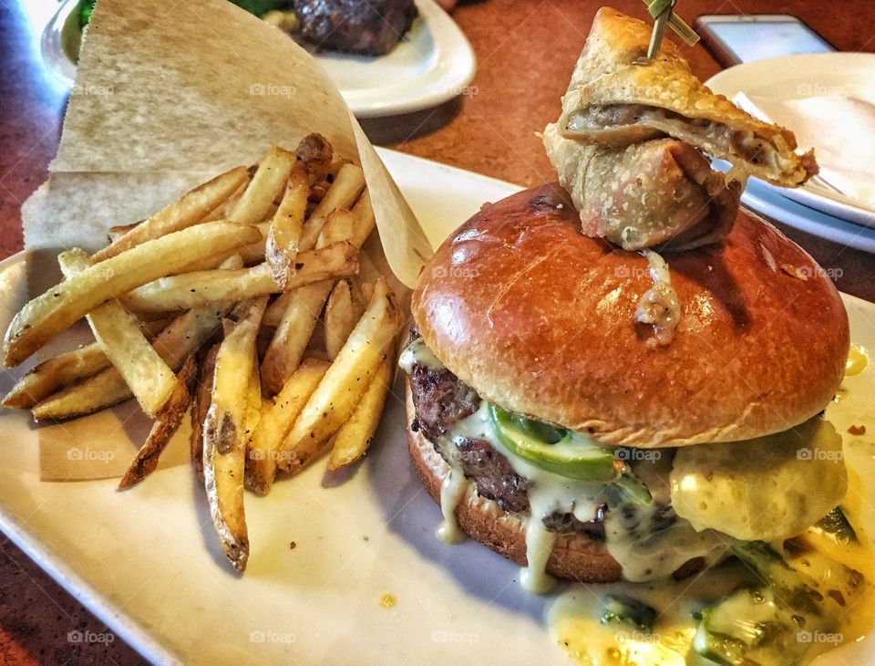 Philly cheese burger and fries
