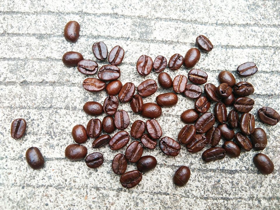 coffee beans on concrete floor