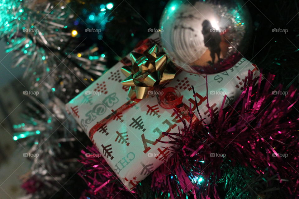 Christmas present on christmas tree