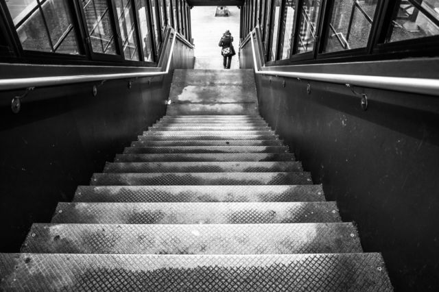 stairs person black white train station by delvec
