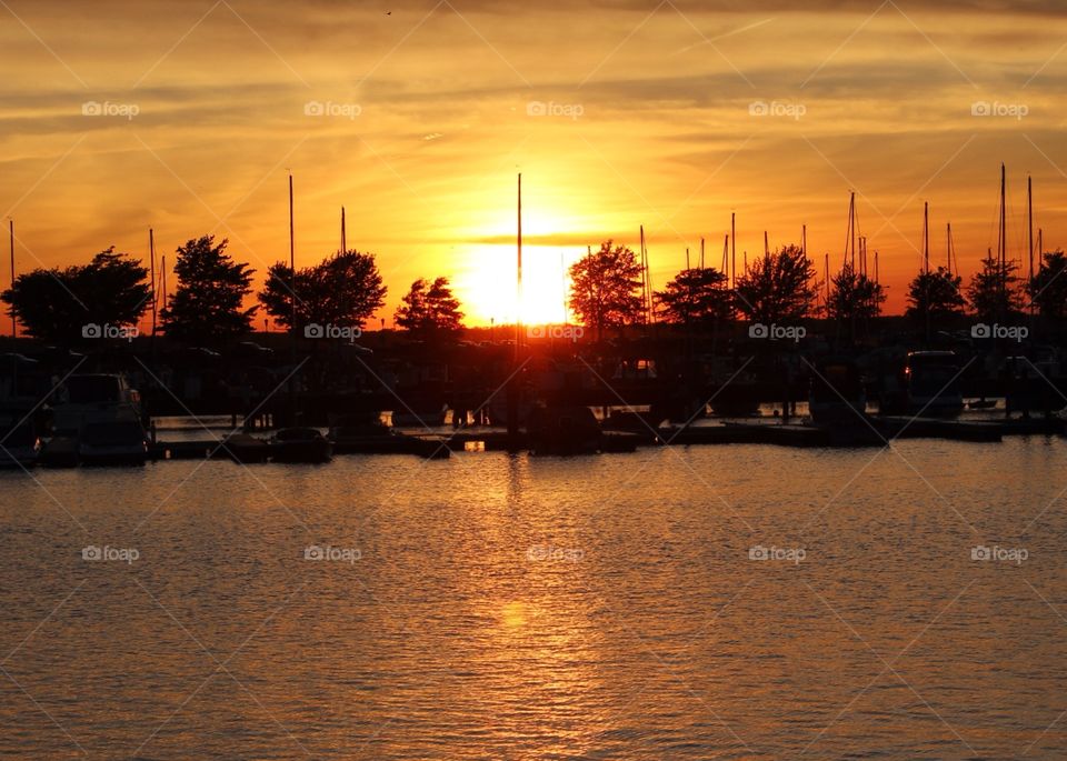 Faith. A cloud in the sky and a mast on a boat create a cross together.  