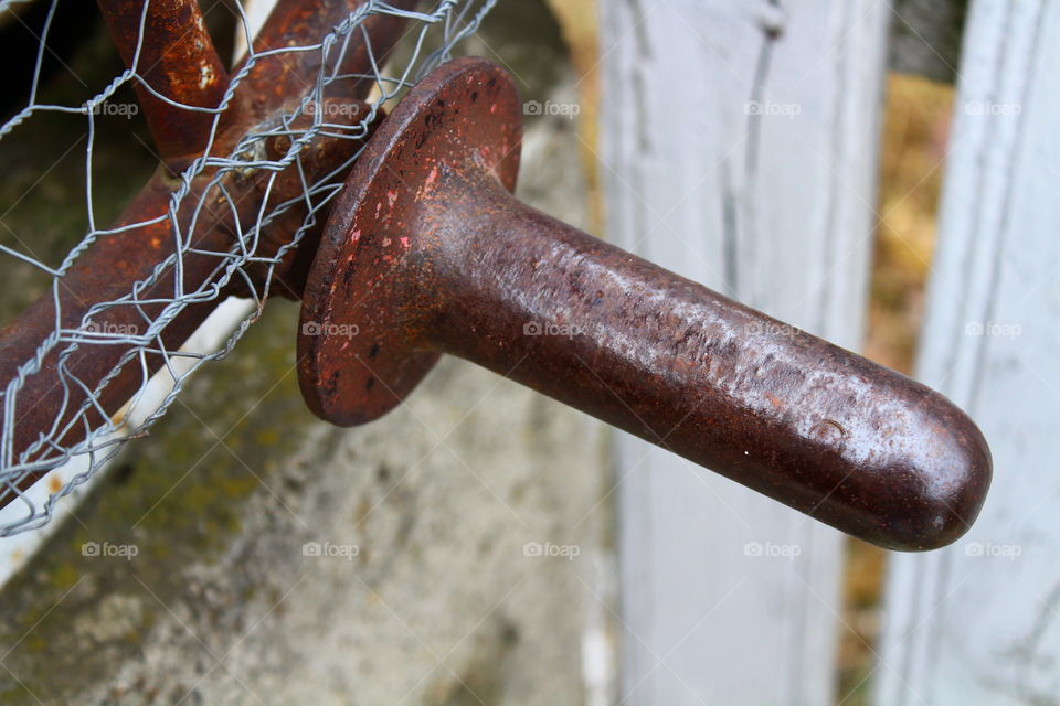 Old rusted handle on a wheel