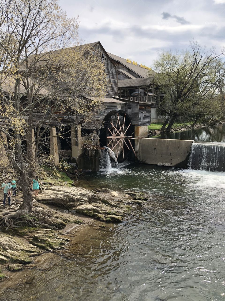 An old mill in Tennesee with water and falls. 
