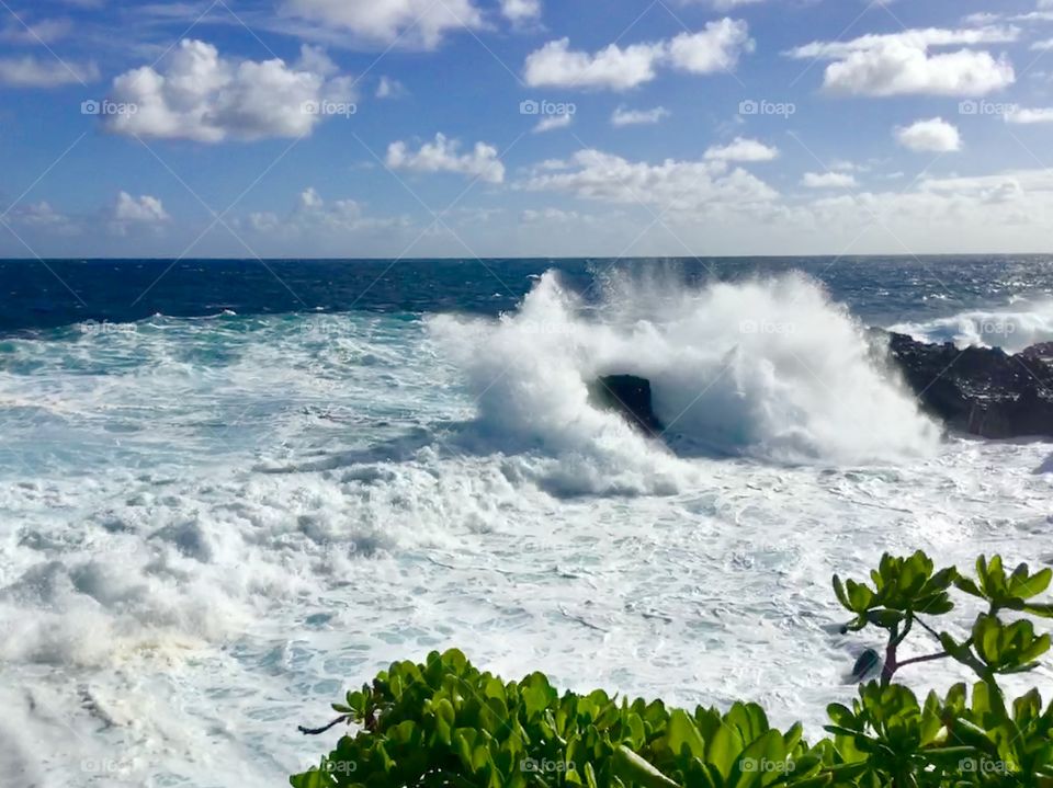 Big splash hitting the lava rock