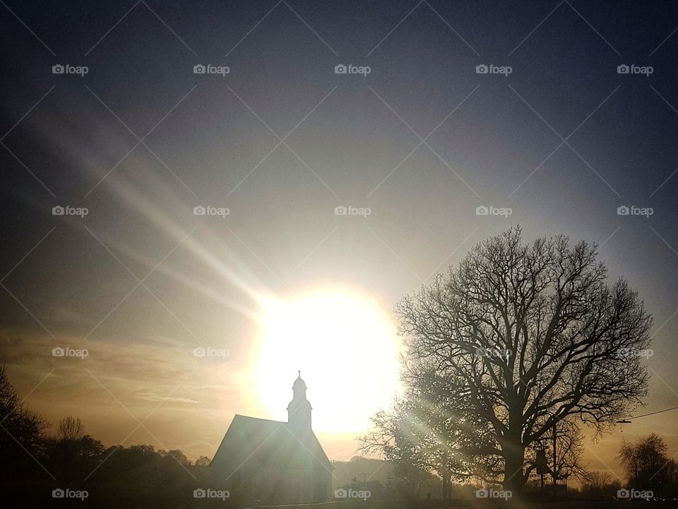 church in front of the sun