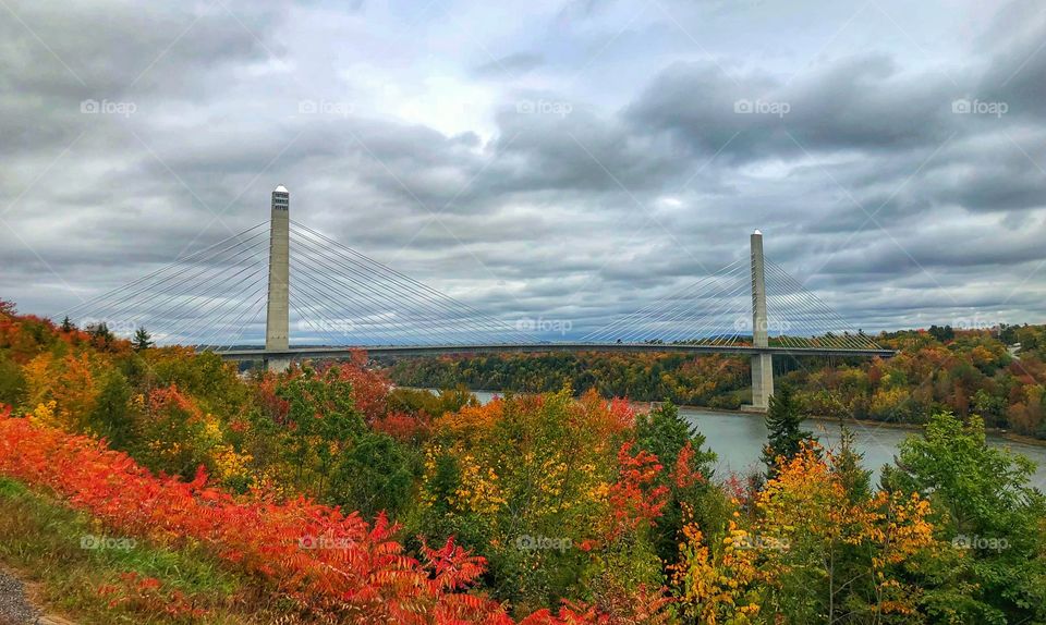 Penobscot Narrows Bridge in Maine. Storm clouds and fall colors perfect combination. Beautiful destination 