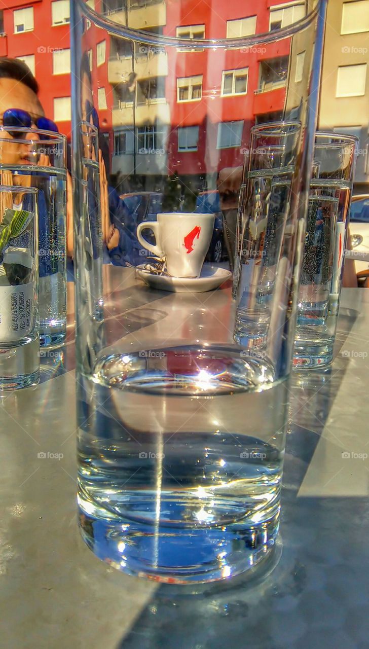 Some kind of art, I guess. A coffee cup shown through glass of water. Interesting.