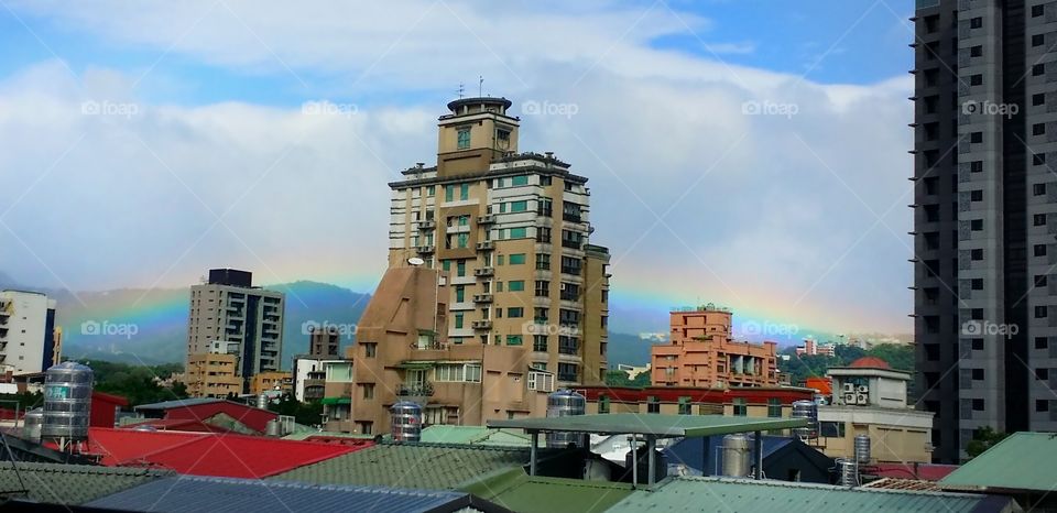 rainbow behind the building