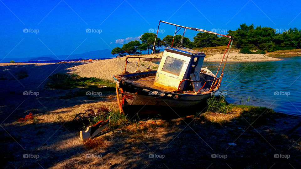 Beautiful rusty boat on a lagoon