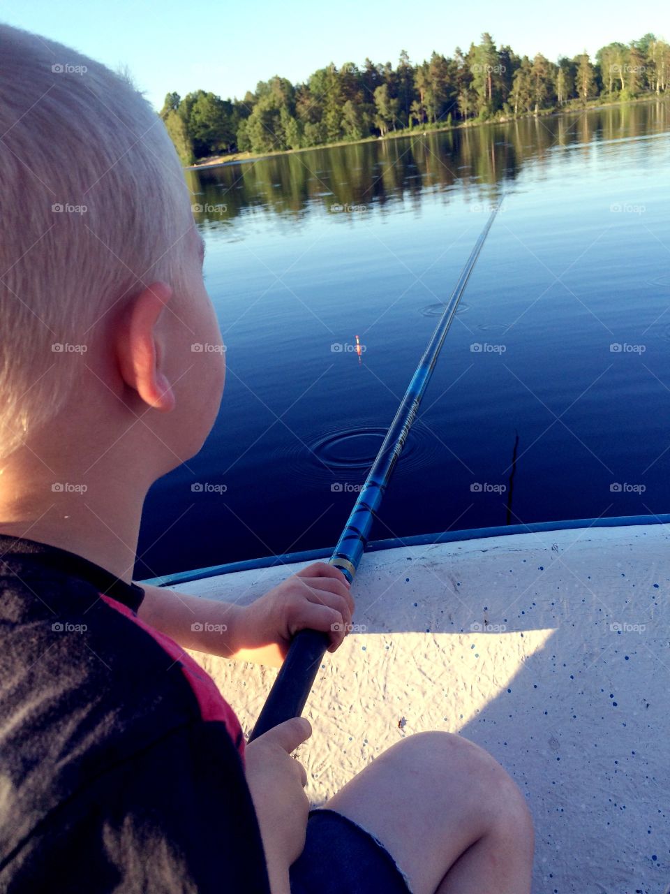 Fishing. Boy fishing in a lake