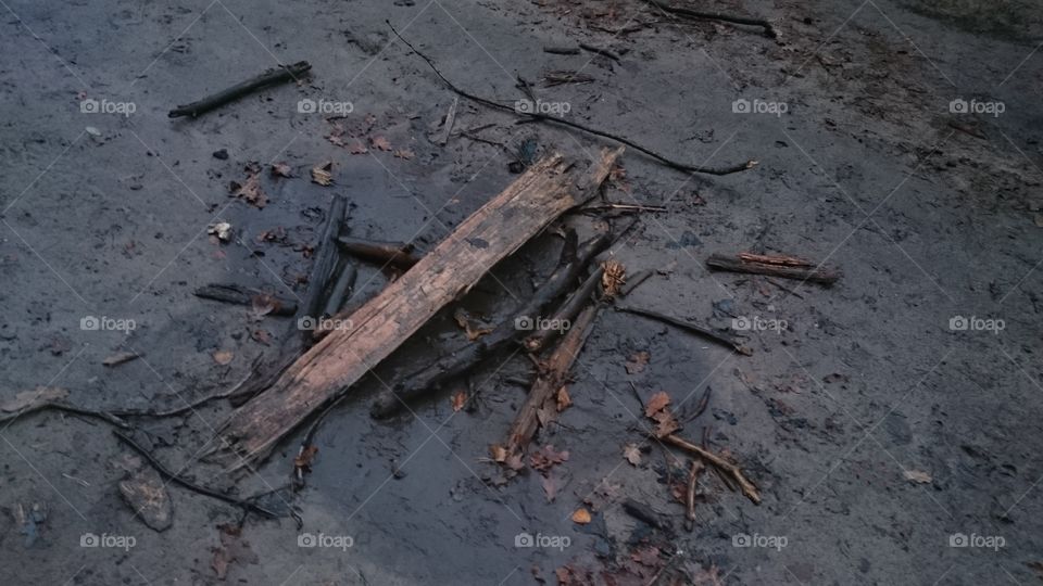 Wreckage on muddy ground