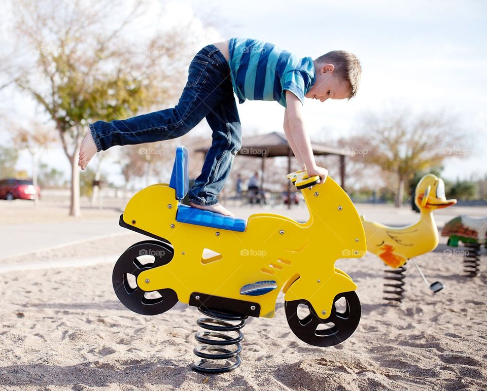 Boy playing in the playground 
