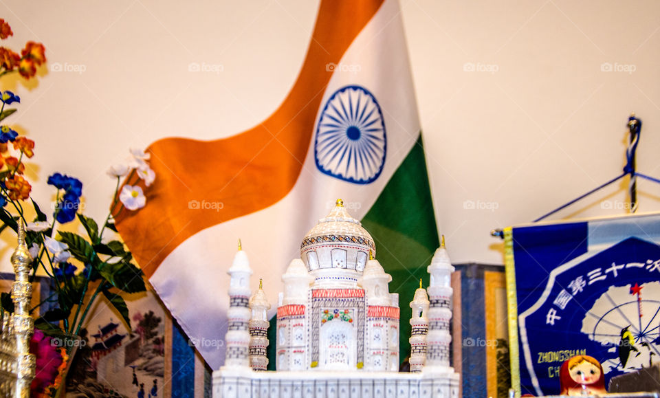 The Indian tricolour . In this picture one can see Tajmahal - one of the wonder of the world and a symbol of love in the foreground and Indian flag in the mid ground depicting how much India and Indians stand as a peace loving country and also shows the importance of love in everyone's life. 
