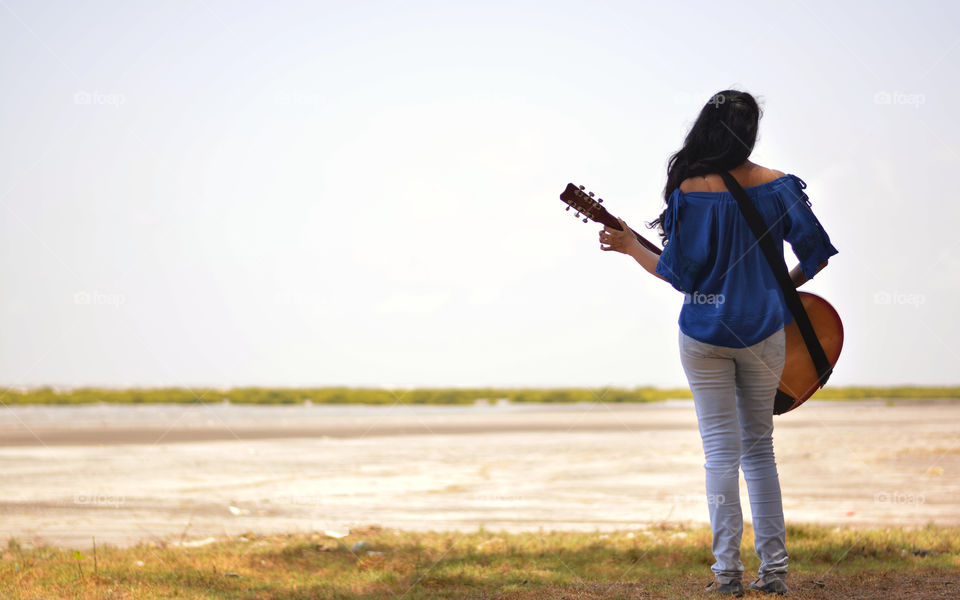Guitar playing girl
