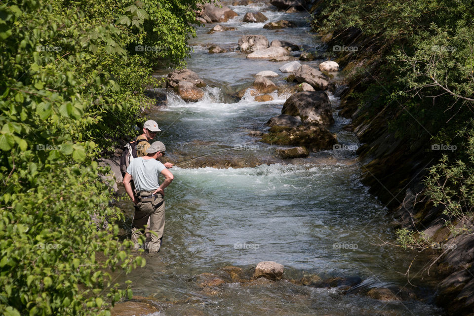 Fisherman fishing in river, Bregenz