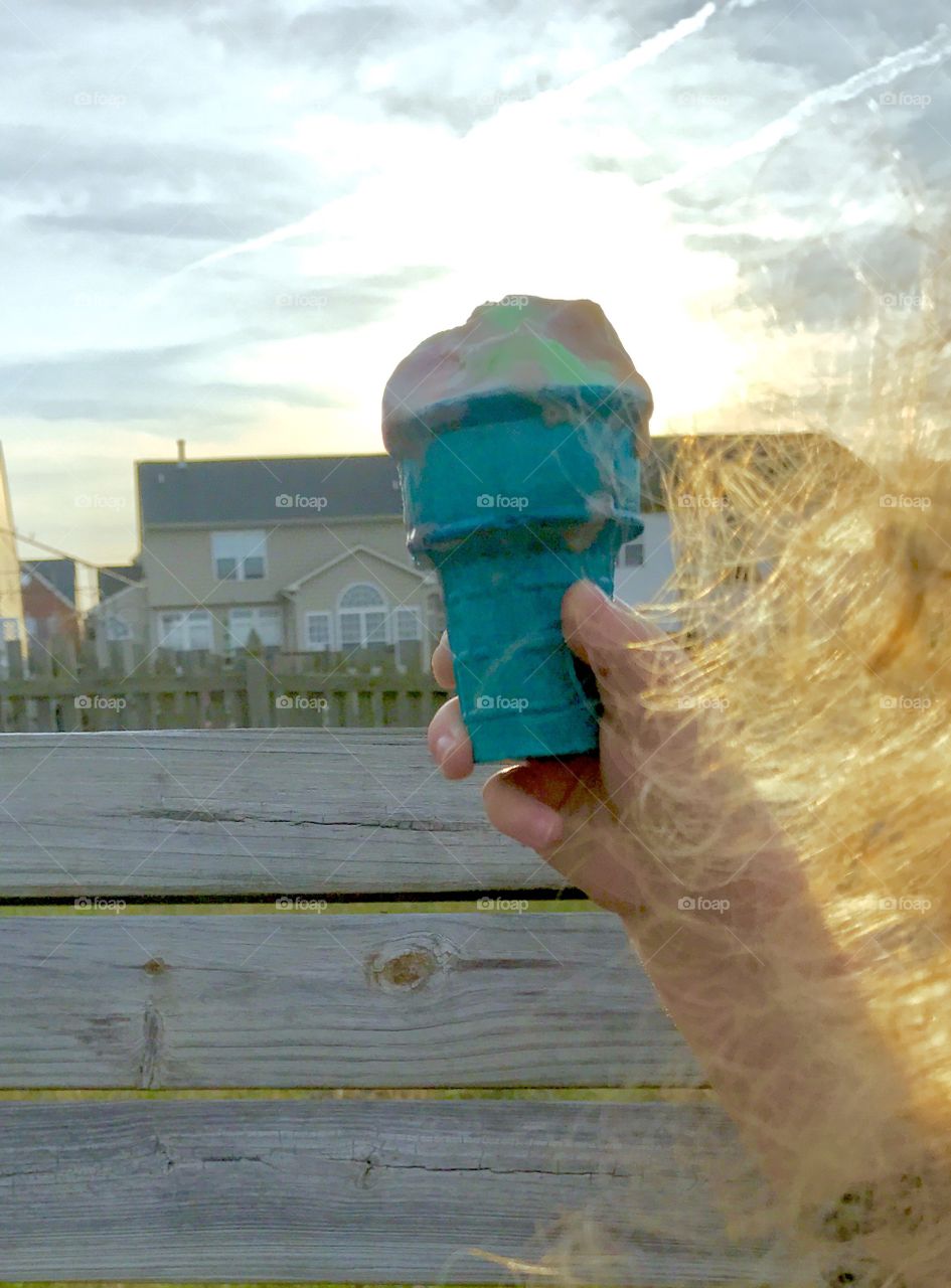 Child holding ice cream cone