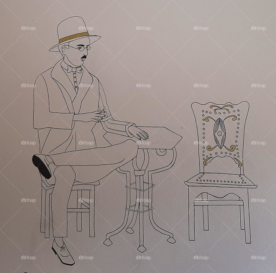 Fernando Pessoa, portuguese writer and poet, in a school wall as portrayed in the statue at the café "A Brasileira", in Lisbon. Recreated by a student.