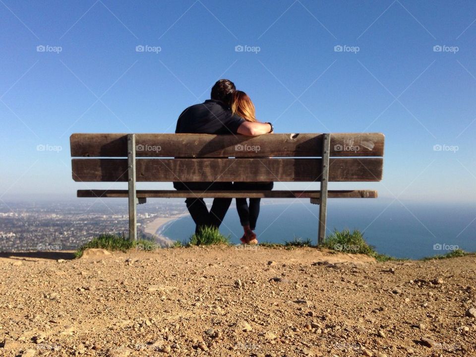 Couple on Bench looking down on LA
