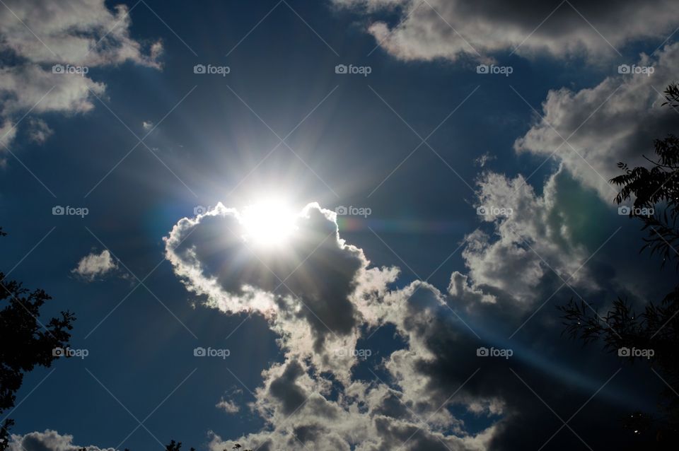 Sun rays through clouds 