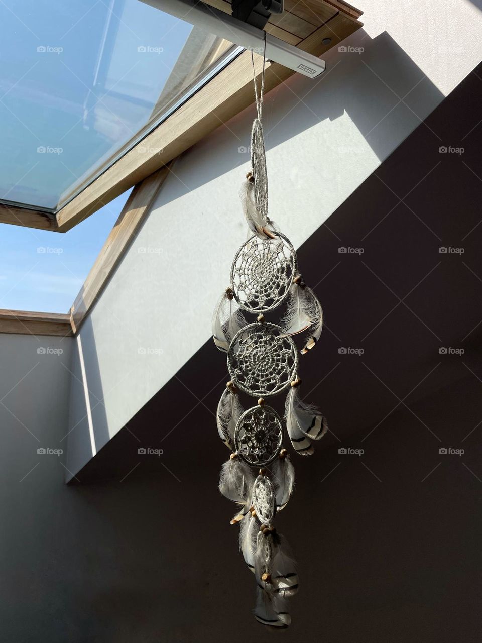 Dream catcher hung on a skylight