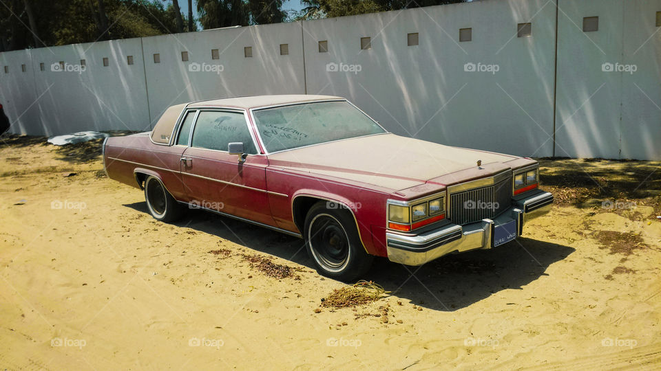 Abandoned Cadillac DeVille in Dubai