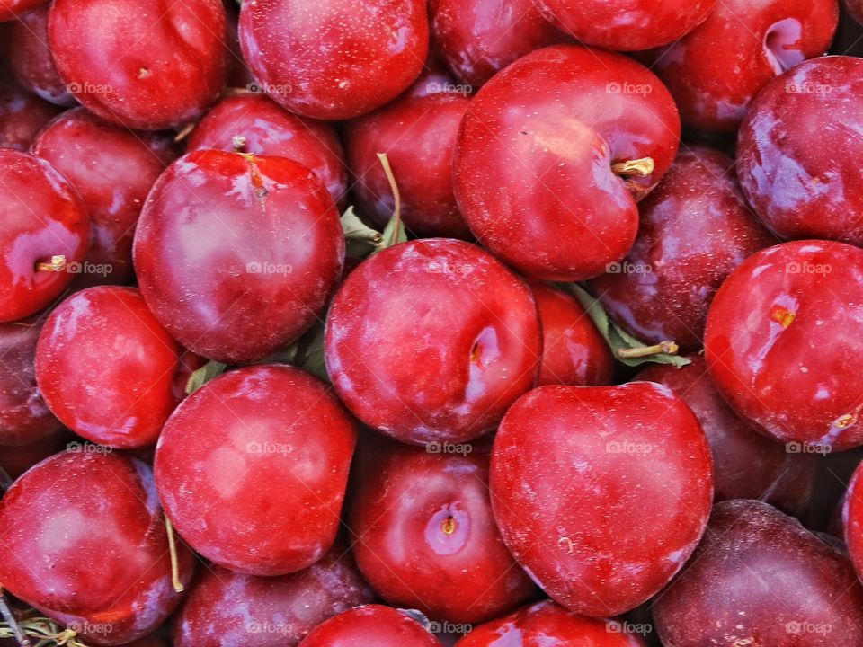 Fresh Juicy Plums. Ripe Plums In Summer Market
