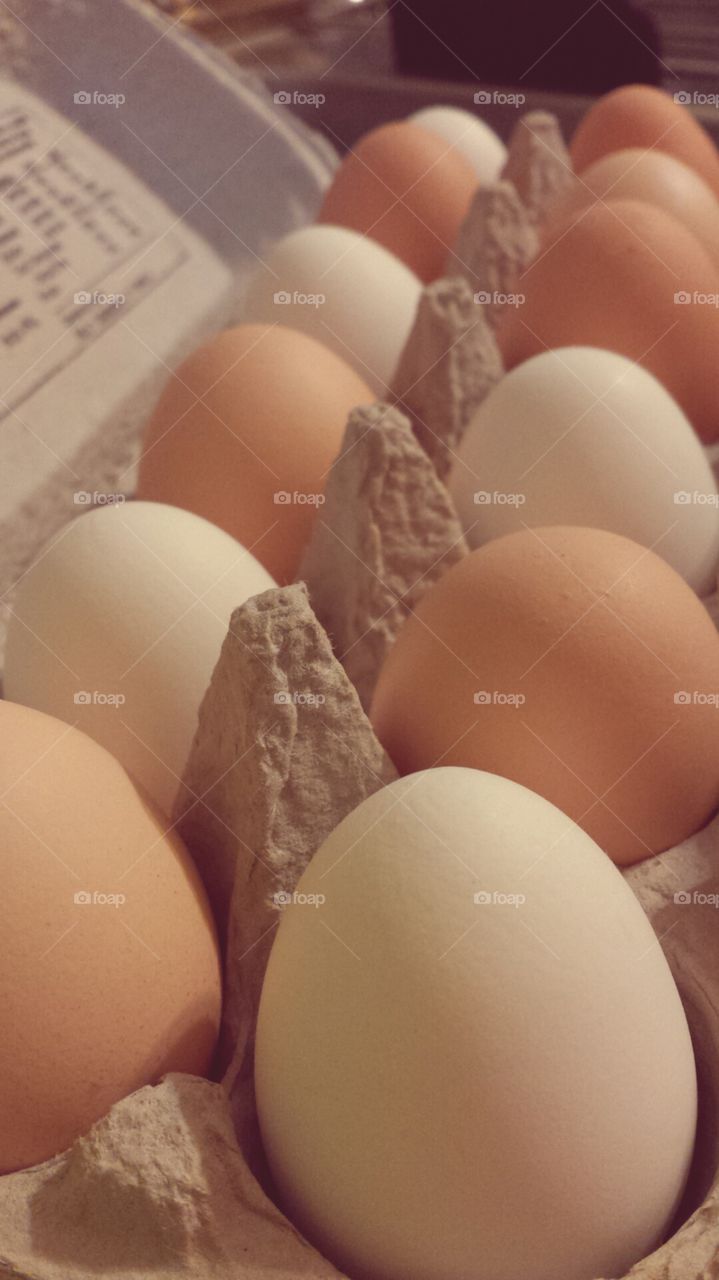 Farm Fresh. A dozen eggs gathered from pastured chickens on a healthy farm.