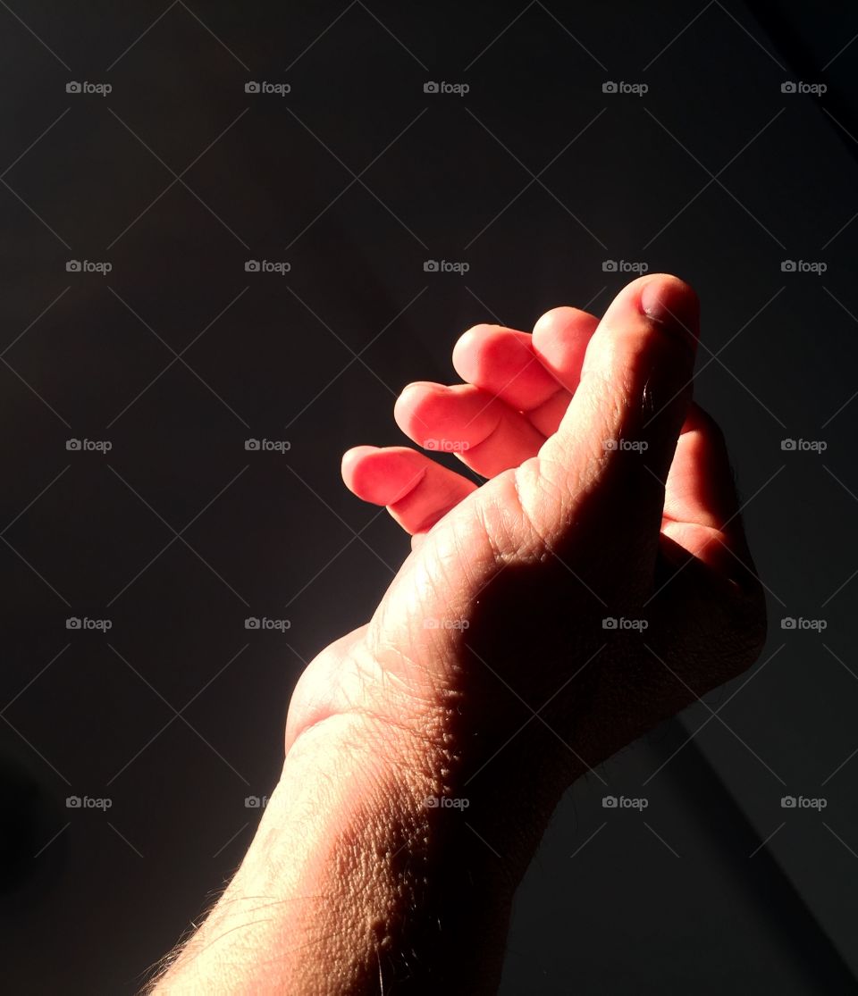 Hand on a black background