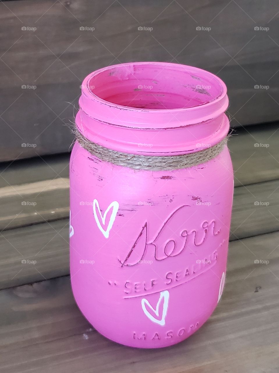 Bright pink mason jar vase with hearts