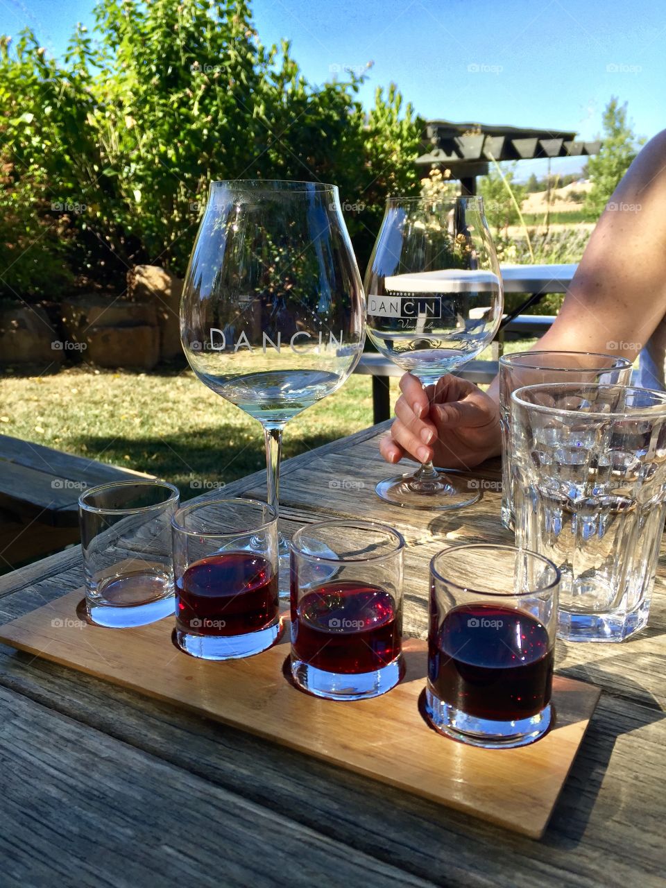 Wine tasting with friends on a sunny summer day at DanCin winery, Medford, Oregon. 