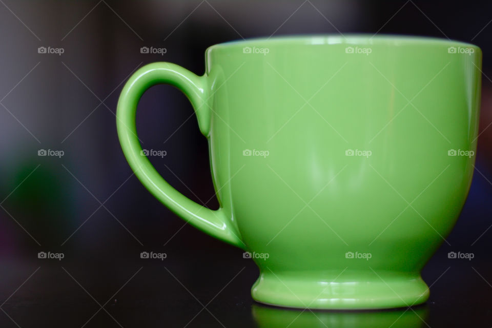 Little green ceramic coffee cup