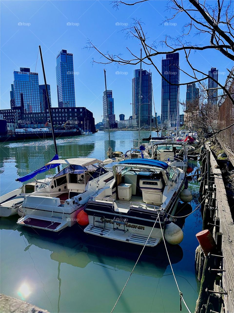 This is “Newtown Creek” by the “Pulaski Bridge” in LIC, Queens with its many boats. Across the water of the “East River” we see “Greenpoint”, Bklyn on the left, LIC and “Manhattan” on the right. 2024. Hypnotic Productions