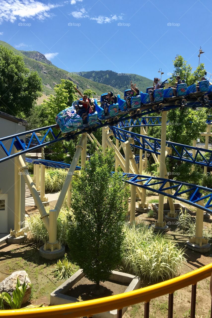 Roller coaster. Amusement ride. Beautiful mountain view. Perfect background. Track. 