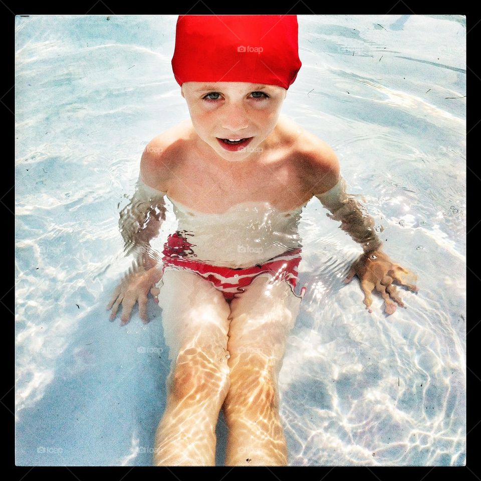 Boy in a swimming pool 